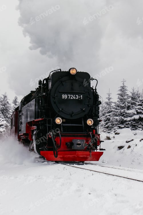 Preview: Historic steam train in winter landscape