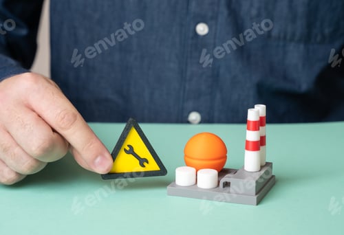Preview: A man shuts down an industrial plant for scheduled maintenance. Routine maintenance