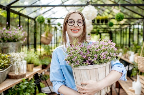 Preview: Woman with lavender in the greenhouse