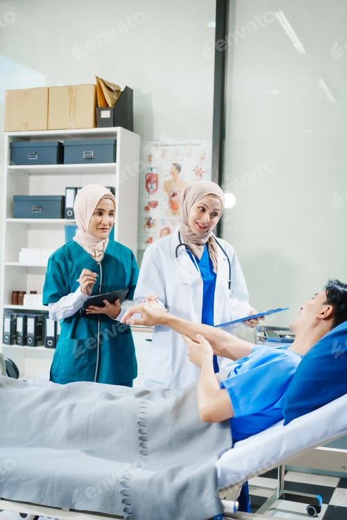Preview: Patient Consultation with Two Smiling Doctors in Hospital