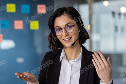 Preview: Professional woman with headset conducting remote business meeting via video call