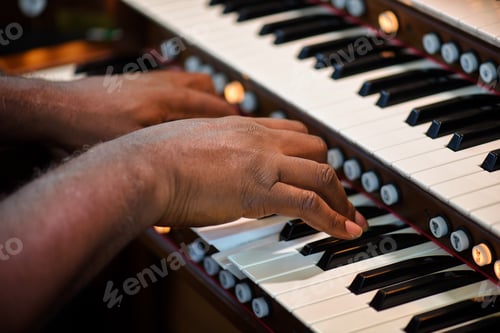 Preview: Church musician plays the two keyboard organ during Sunday morning worship
