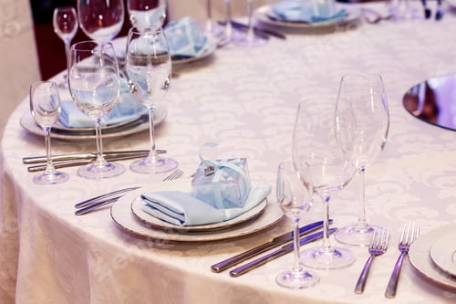 Preview: luxury wedding arrangement of stylish glasses plates on napkins and silver cutlery
