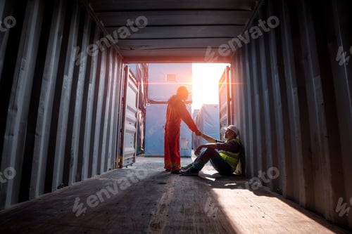 Preview: Engineer or worker sit close to cargo container look like tired after work in workplace area for lon