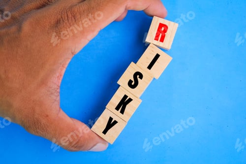 Preview: hand holding a wooden cube with the word risky.