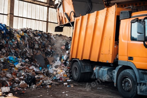 Preview: A garbage truck working at waste sorting plant