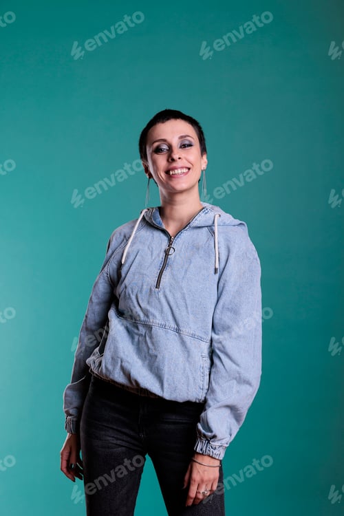 Preview: Portrait of smiling woman looking at camera during studio shot posing confident