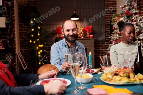 Preview: Young man enjoying festive xmas dinner