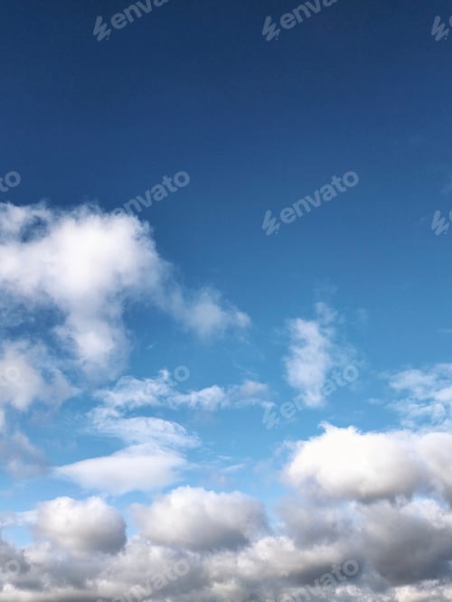 Preview: blue sky view with white and gray clouds