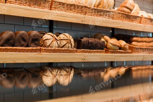 Preview: Freshly baked bread laid out in baskets on bakery counter