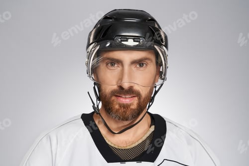 Preview: Handsome bearded hockey player in black helmet.
