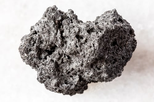 Preview: sample of rough pumice mineral on white marble