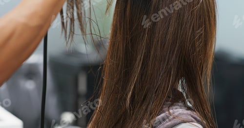 Preview: Close Up of Long Brown Hair Styling