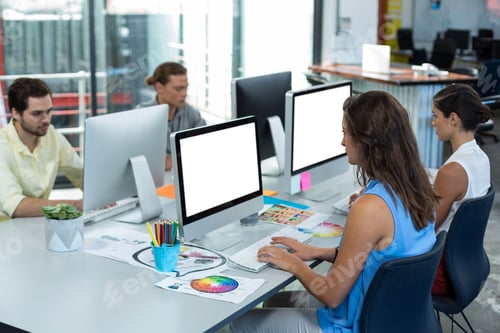 Preview: Graphic designers working on personal computer