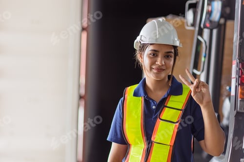 Preview: happy woman engineer worker Asian Latin Indian lady staff work in large factory warehouse