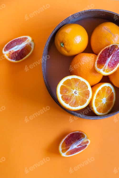 Preview: Fresh juicy oranges on colorful background