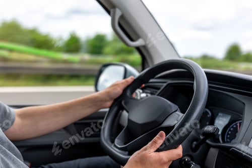 Preview: Hands on steering wheel. Driver holding wheel. Car control in motion.