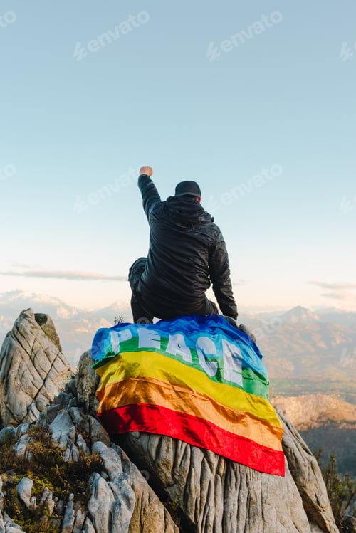 Preview: Hiker man sitting on a rock