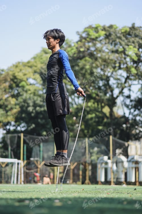 Preview: Young man jumping use skipping rope