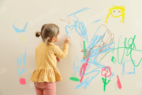 Preview: Little child drawing on white wall, back view