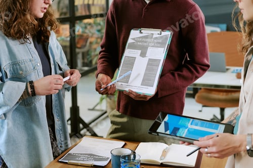 Preview: Young Adult Multiethnic Team Collaborating during Real Estate Presentation