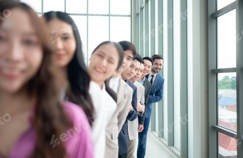 Preview: Group of business people standing in line in conference room used for meeting in modern office,