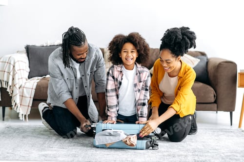 Preview: Happy african american family of three going to travel. Cheerful dad mom and their cute preschool