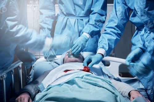 Preview: Doctors, surgery and collaboration with a medicine team in scrubs operating on a man patient in a h