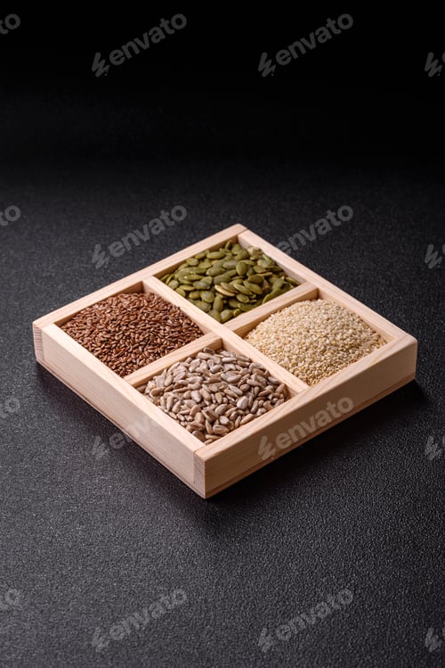 Preview: Sunflower, pumpkin, flax and sesame seeds in a wooden box