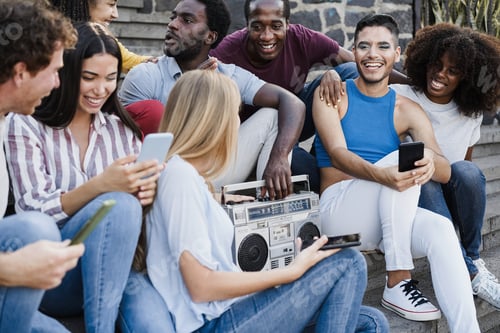 Preview: Young diverse people dancing and listening music with boombox stereo outdoor in the city