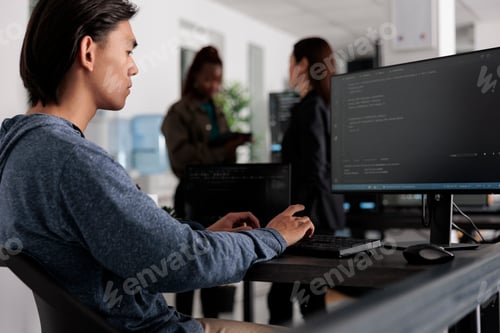 Preview: Engineers programming server code algorithm on computer