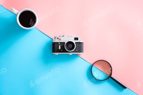Preview: Vintage retro camera on a colored background, flat lay, minimalism.
