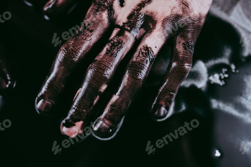 Preview: Men's hands in black paint, modern Art.