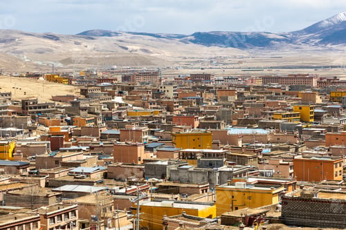 Preview: Elevated view of Litang old town in Ganzi Tibetan autonomous region, with scenic mountains in the