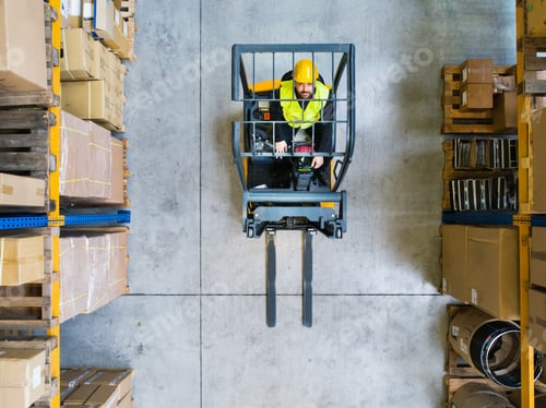 Preview: Warehouse man worker with forklift.