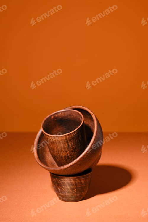 Preview: Composition with clay bowls on orange background