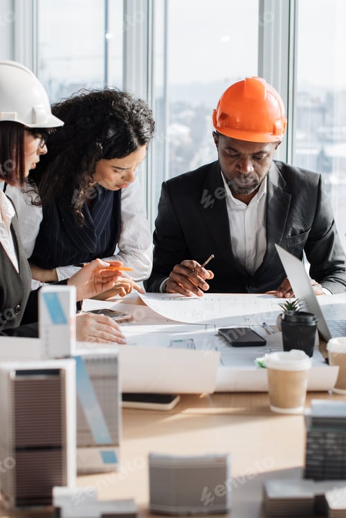 Preview: Architects Discussing Blueprints