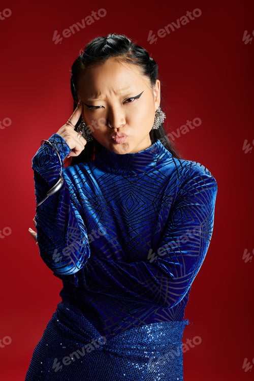 Preview: A striking Asian woman poses with confidence, showcasing her unique style and attitude