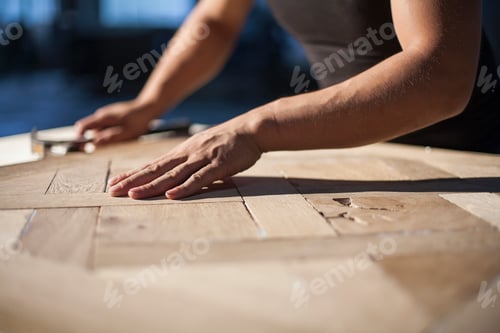 Preview: Carpenter piecing together wood blocks in factory, Jiangsu, China