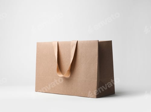 Preview: Paper shopping bag with comfortable handles on white background. Mockup for design