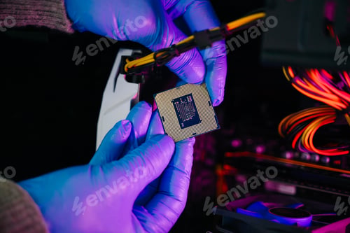 Preview: The technician is putting the CPU on the socket of the computer motherboard. electronic engineering