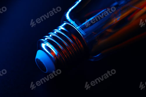 Preview: Light bulb on black background close up
