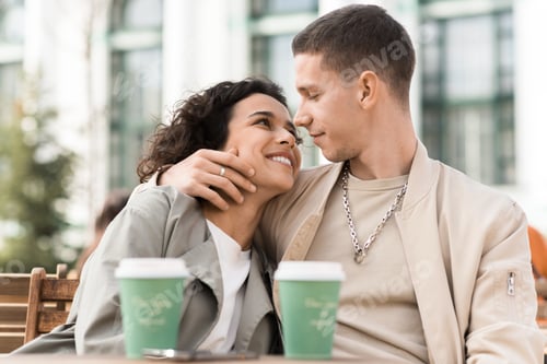 Preview: A happy couple outdoors near a cafe