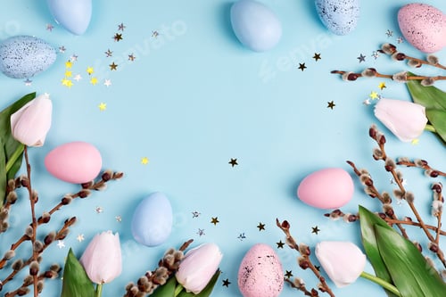 Preview: Festive frame with Easter handcraft painted eggs and tulips flowers border on a light blue