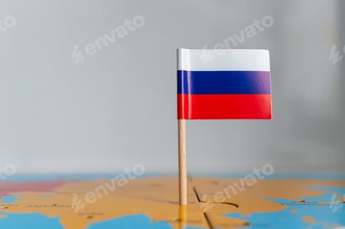 Preview: Small flag of Russia on a wooden stick fixed on the globe