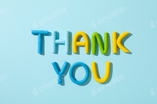 Preview: The word "thank you" from colored plasticine on a blue background.