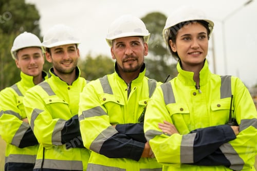 Preview: Engineer worker in arms crossed standing in a row looking smile to camera