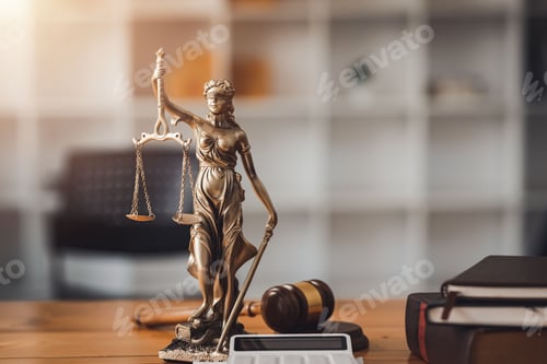 Preview: Statue of lady justice on desk of a judge or lawyer.
