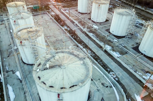 Preview: Aerial view of big fuel reservoires in petrol industrial zone in winter.