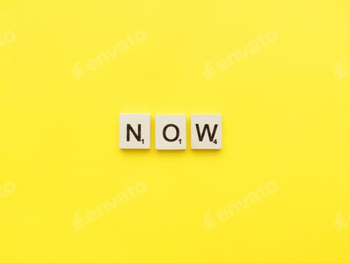 Preview: Now scrabble letters word on a yellow background